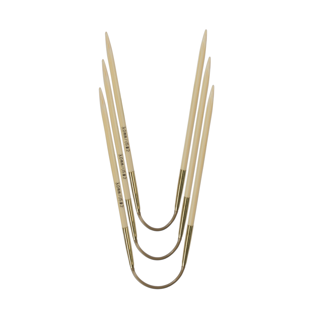 Three short, flexible double-pointed needles, called CraSyTrio Bamboo
